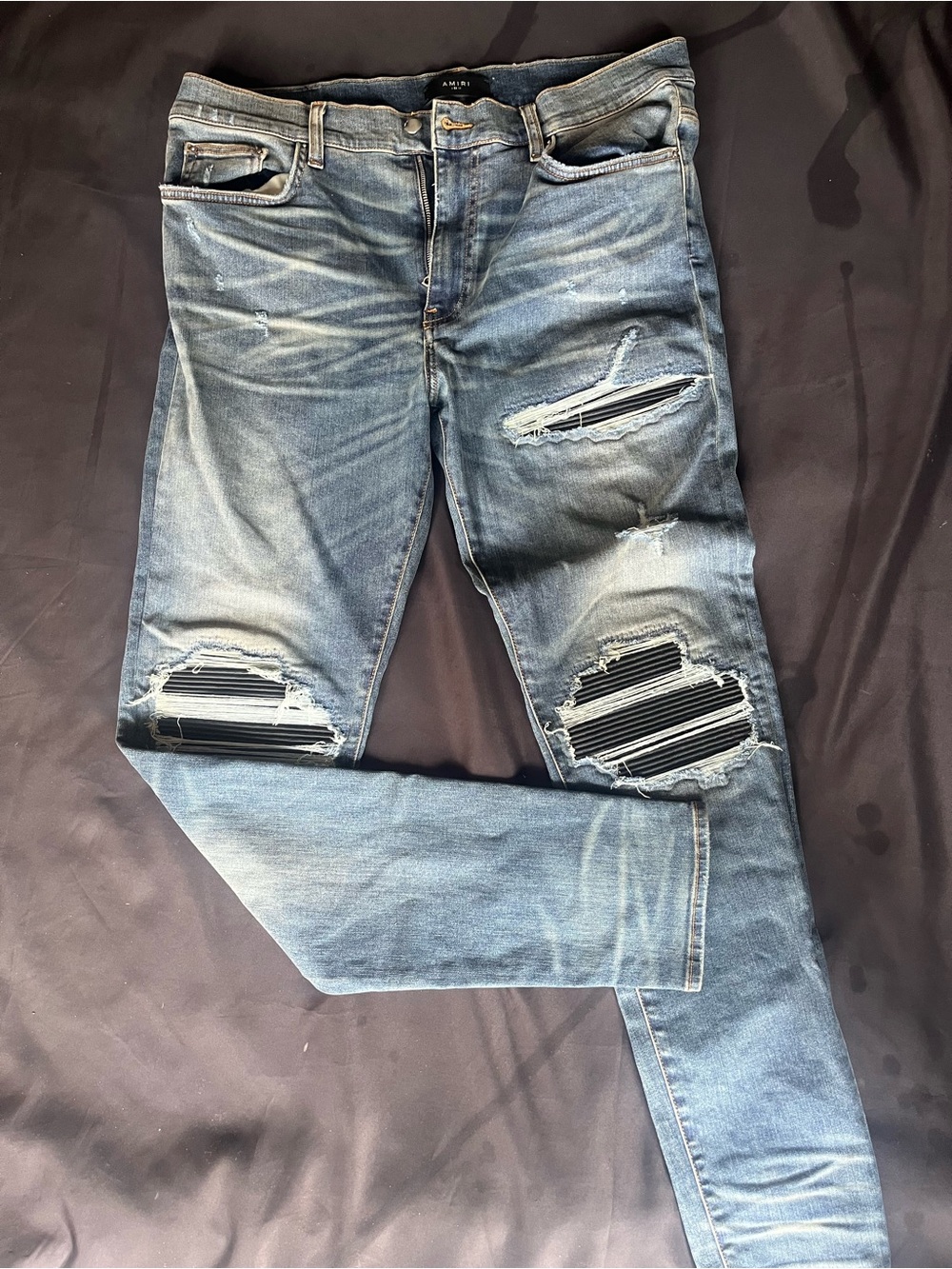 AMIRI Washed Light Blue Distressed Skinny Jeans
